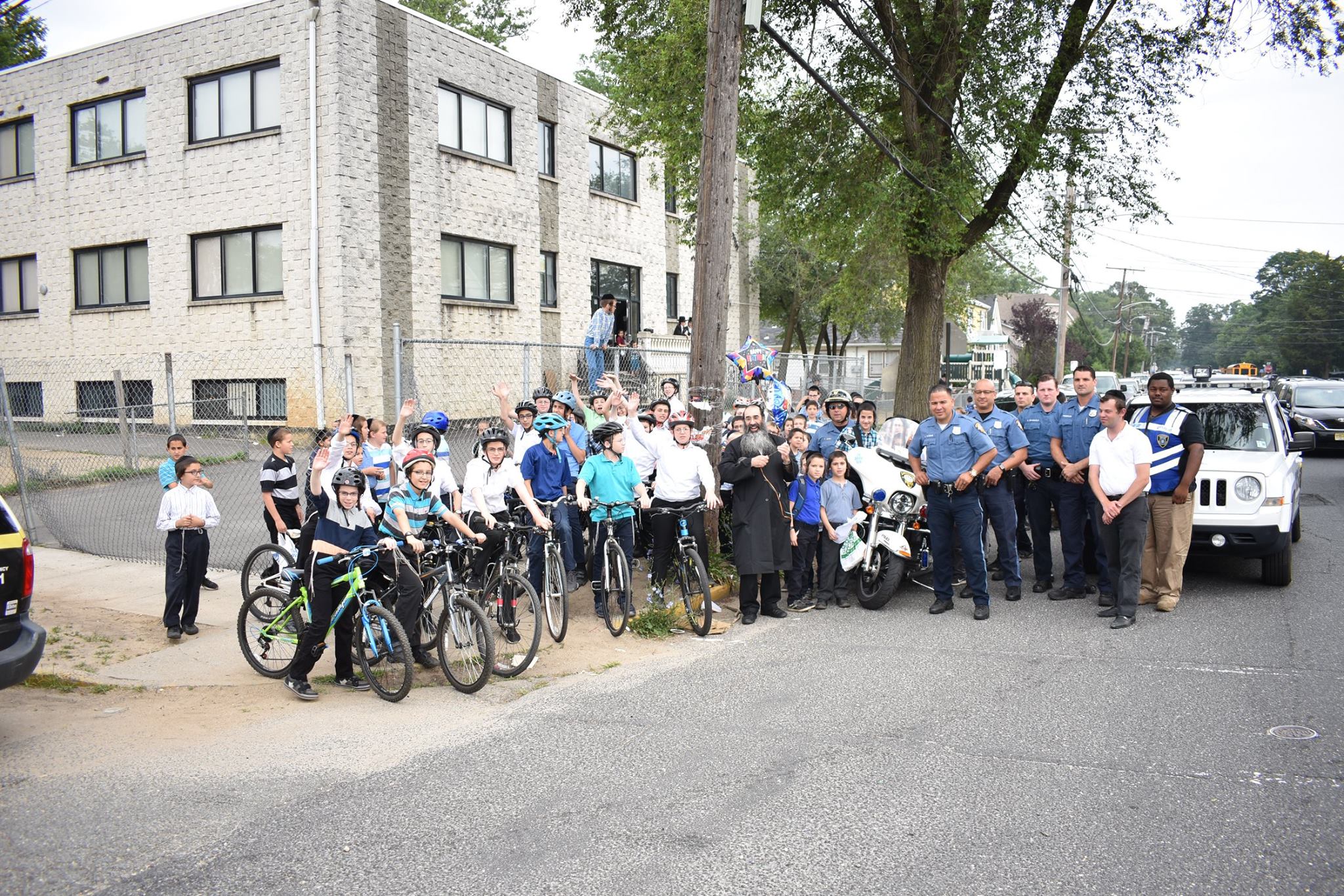 LCSW Assisting Lakewood Police with a School Bike Ride